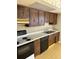 Classic kitchen features wood cabinets, built-in appliances, and ample counter space at 6104 Madison Ave, Indianapolis, IN 46227