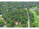 Aerial view of a wooded lot near a golf course and pond at 35 W 72Nd St, Indianapolis, IN 46260