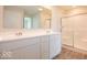 Bright bathroom with double sinks and a large shower at 1448 Buttercup Ln, Shelbyville, IN 46176