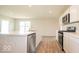 Modern kitchen with island, stainless steel dishwasher and range at 1448 Buttercup Ln, Shelbyville, IN 46176
