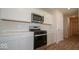 Modern kitchen with stainless steel range and microwave at 1448 Buttercup Ln, Shelbyville, IN 46176