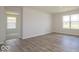 Bright bedroom with hardwood floors and access to another room at 1448 Buttercup Ln, Shelbyville, IN 46176