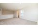 Spacious loft area with neutral carpet and natural light at 1448 Buttercup Ln, Shelbyville, IN 46176