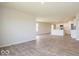 Open living room with hardwood floors and kitchen island view at 1448 Buttercup Ln, Shelbyville, IN 46176