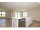 Modern kitchen with island and stainless steel appliances at 1448 Buttercup Ln, Shelbyville, IN 46176
