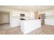 Modern kitchen with island, stainless steel appliances, and white cabinets at 1448 Buttercup Ln, Shelbyville, IN 46176