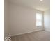 Simple bedroom with neutral walls and carpet at 1448 Buttercup Ln, Shelbyville, IN 46176