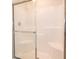 Clean shower with glass enclosure and built-in shelves at 1448 Buttercup Ln, Shelbyville, IN 46176