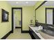 Guest bathroom with double vanity and walk-in shower at 9825 Windy Hills Dr, Zionsville, IN 46077
