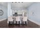 Small kitchen with gray cabinets and a granite countertop island at 9825 Windy Hills Dr, Zionsville, IN 46077