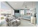 Spacious main bedroom with sitting area, serene views, and elegant furnishings at 9825 Windy Hills Dr, Zionsville, IN 46077