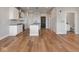 Modern kitchen with island, stainless steel appliances, and hardwood floors at 319 E 16Th St # 403, Indianapolis, IN 46202