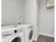 Bright laundry room with side-by-side washer and dryer, and extra storage at 319 E 16Th St # 403, Indianapolis, IN 46202