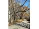 Private road leading through a wooded area with fall colors at 2131 N Wolf Den Ln, Martinsville, IN 46151