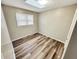 Spacious bedroom with neutral walls and vinyl flooring at 320 Northern Ave, Indianapolis, IN 46208