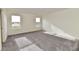 Bright bedroom with grey carpet and two large windows at 11021 Underwood Ct, Indianapolis, IN 46235