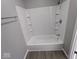 Clean bathroom with a tub and shower combination at 213 E Broadway St, Alexandria, IN 46001