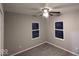 Bedroom with two windows and ceiling fan at 213 E Broadway St, Alexandria, IN 46001
