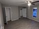 Spacious bedroom with ample closet space and wood-look flooring at 213 E Broadway St, Alexandria, IN 46001
