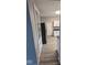 Kitchen features white cabinets, modern appliances, and vinyl flooring at 213 E Broadway St, Alexandria, IN 46001