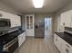 Open concept kitchen with stainless steel appliances and vinyl flooring at 213 E Broadway St, Alexandria, IN 46001