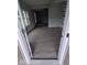 Living room with gray walls, wood-look flooring and a view into the kitchen at 213 E Broadway St, Alexandria, IN 46001