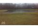 Image of a pond on a property with surrounding grass at 2645 Faust Ct, Carmel, IN 46033