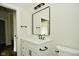 Stylish bathroom with white vanity and a black framed mirror at 2749 Stones Bay Dr, Greenwood, IN 46143
