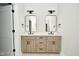 Modern bathroom with double vanity and sleek light fixtures at 2749 Stones Bay Dr, Greenwood, IN 46143