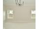 Bright bedroom with neutral walls, carpet, and two windows at 2749 Stones Bay Dr, Greenwood, IN 46143