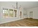 Bright dining room with chandelier and access to backyard at 2749 Stones Bay Dr, Greenwood, IN 46143