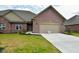 Brick ranch home with 2-car garage and landscaped lawn at 2749 Stones Bay Dr, Greenwood, IN 46143
