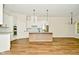 Modern kitchen with white cabinets, stainless steel appliances, and island at 2749 Stones Bay Dr, Greenwood, IN 46143
