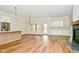 Spacious kitchen with island, white cabinets, and hardwood floors at 2749 Stones Bay Dr, Greenwood, IN 46143