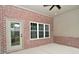 Covered patio with brick wall and ceiling fan at 2749 Stones Bay Dr, Greenwood, IN 46143