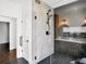 Bathroom with a glass shower and herringbone tile floor at 725 N Cleveland St, Indianapolis, IN 46202