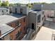 Aerial view of a modern three-story townhome with a rooftop deck at 725 N Cleveland St, Indianapolis, IN 46202