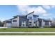 Modern two-story home with stone and siding accents, showcasing a stylish design at 9280 Highpointe Ln, Zionsville, IN 46077