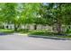 White brick house with landscaping and a paved driveway at 4501 N Wheeling Ave # 3-106, Muncie, IN 47304