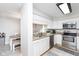 Well-equipped kitchen featuring white cabinets and granite countertops at 8751 Jaffa Court E Dr # 35, Indianapolis, IN 46260