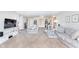 Open concept living room with ample seating and a work area at 8751 Jaffa Court E Dr # 35, Indianapolis, IN 46260