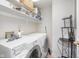 Convenient laundry room with washer, dryer, and extra shelving at 8751 Jaffa Court E Dr # 35, Indianapolis, IN 46260