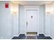 Inviting condo entry with a white door and a welcome mat at 8751 Jaffa Court E Dr # 35, Indianapolis, IN 46260