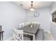 Charming dining area with a gray table and white chairs at 8751 Jaffa Court E Dr # 35, Indianapolis, IN 46260