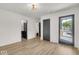 Bright entryway with wood-look floors, leading to other rooms at 679 E 16Th St, Indianapolis, IN 46202