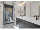Elegant bathroom with dual vanities, dark cabinets, and gold accents at 679 E 16Th St, Indianapolis, IN 46202