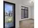Bright bedroom with balcony access and hardwood floors at 679 E 16Th St, Indianapolis, IN 46202