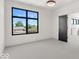 Bedroom with grey carpet and large window at 679 E 16Th St, Indianapolis, IN 46202