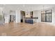 Modern kitchen features an island, stainless steel appliances, and hardwood floors at 679 E 16Th St, Indianapolis, IN 46202