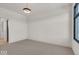 Spacious bedroom with grey carpet and large window at 679 E 16Th St, Indianapolis, IN 46202